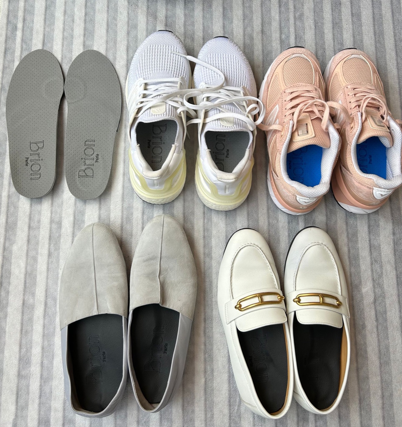 Albin Brion custom insoles beside trainers and dress shoes